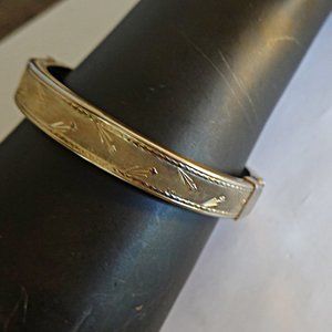 Vintage goldtone hinged Coro bangle bracelet with chain